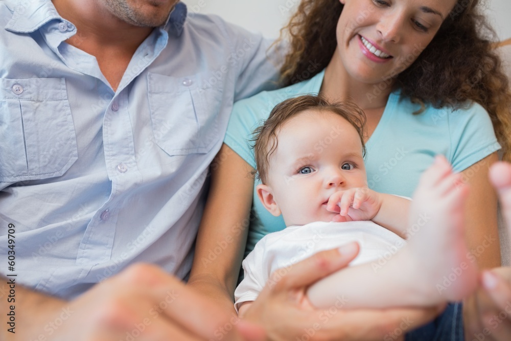Cute baby sitting with parents Cute baby sitting with parents