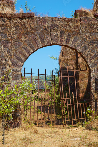 Abandoned Portuguese fort. Chapora river bank. Goa, India. photo