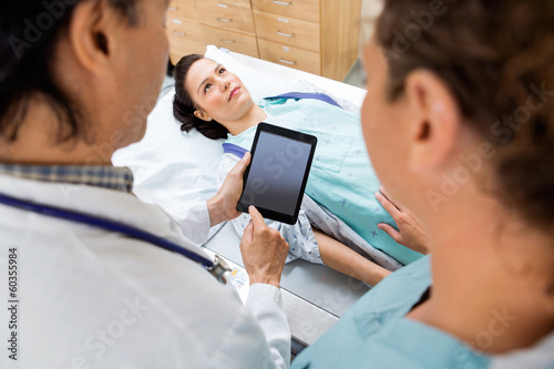 Medical Team With Patient In Hospital Room