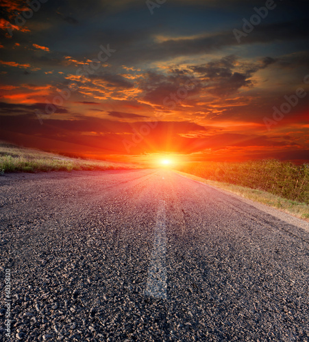 asphalt road on sunset background