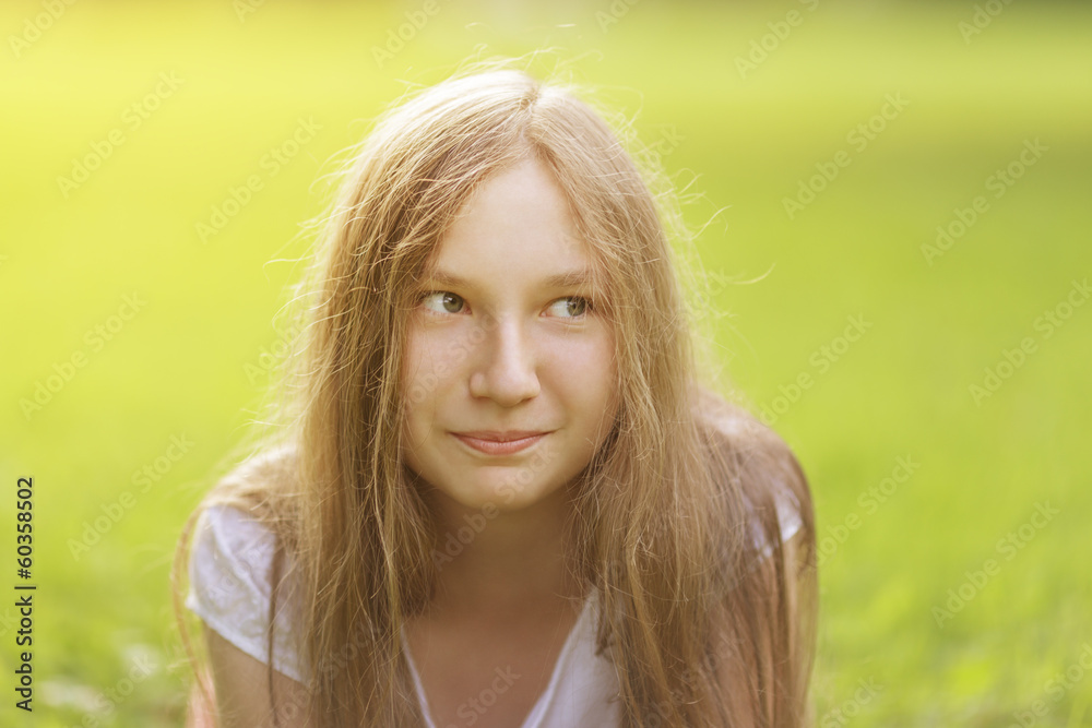 teenage girl outdoors with playful look