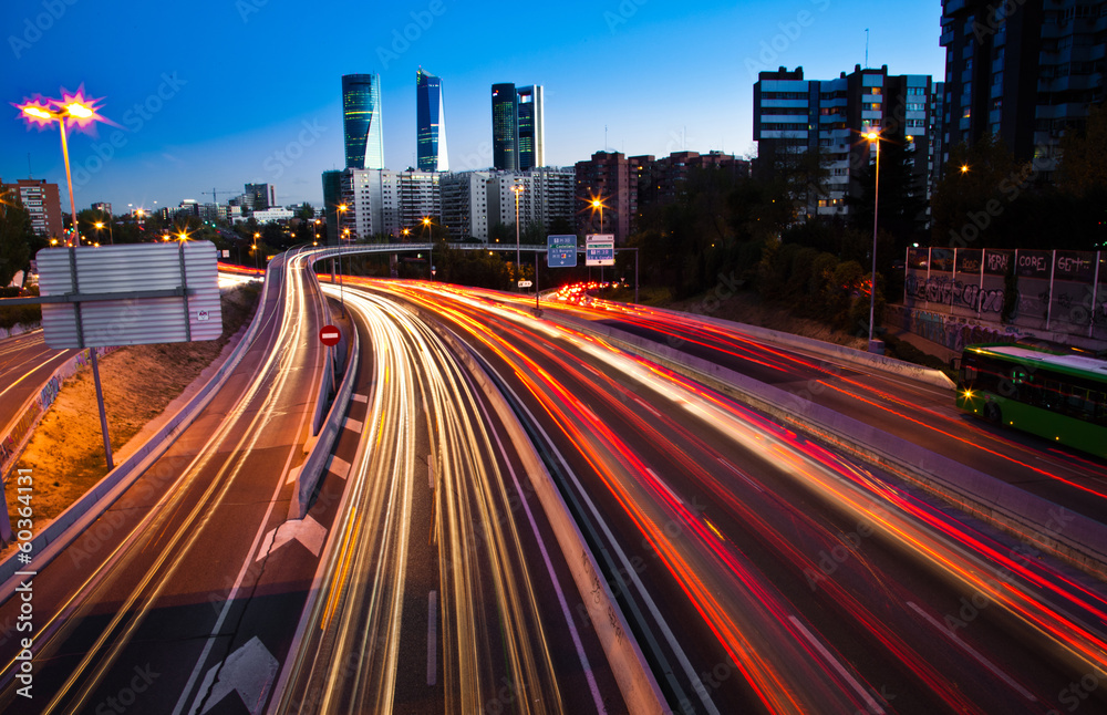 Obraz premium Blurred Tail Lights And Traffic Lights On Motorway