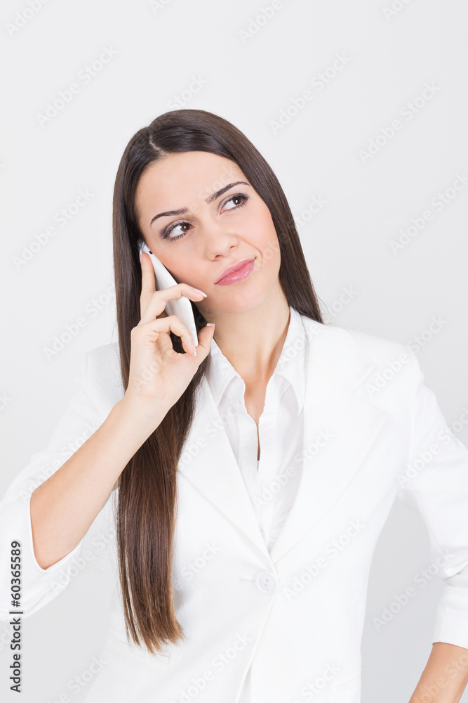 Beautiful young businesswoman speaking on the phone Beautiful young businesswoman speaking on the phone