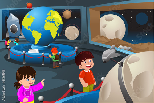 Kids on a field trip to a planetarium