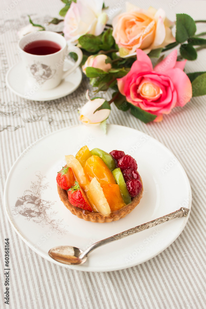 Tartlet with fresh fruits and berries, closeup Tartlet with fresh fruits and berries, closeup