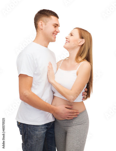 happy young family expecting child