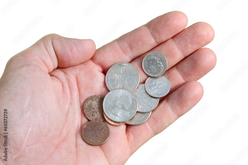 Hand with a few coins isolated on white Hand with a few coins isolated on white