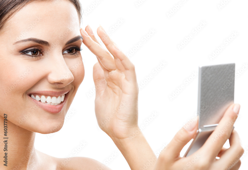 Woman looking at mirror, isolated over white Woman looking at mirror, isolated over white