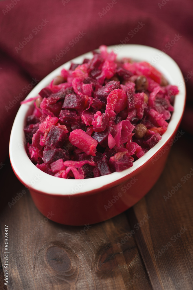 Vertical shot of russian traditional beetroot salad, close-up Vertical shot of russian traditional beetroot salad, close-up