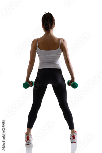 sport girl doing with dumbbells, fitness woman studio shot in si