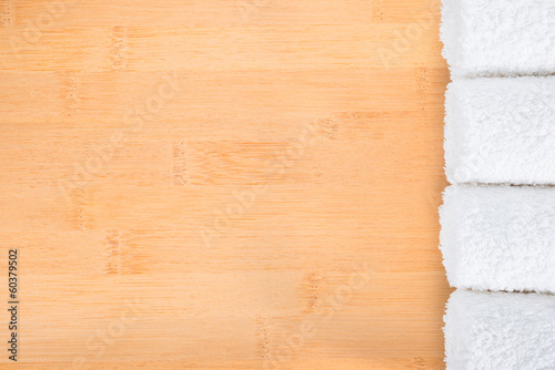 white towels on bamboo wooden background