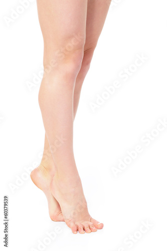 beautiful graceful female legs of young woman over white © Khorzhevska
