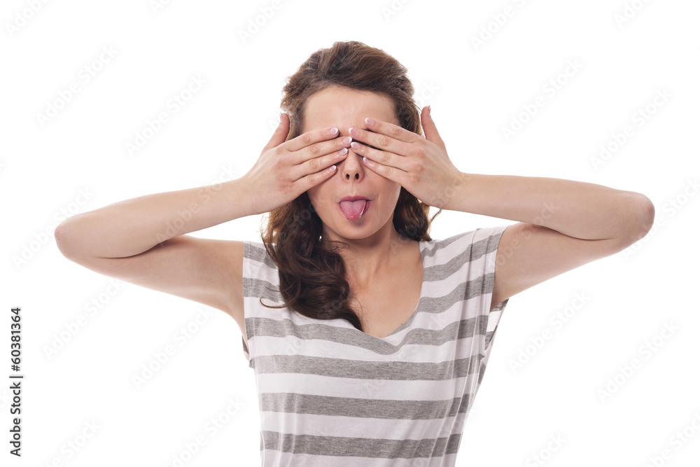 Funny woman covering eyes and sticking out tongue Funny woman covering eyes and sticking out tongue