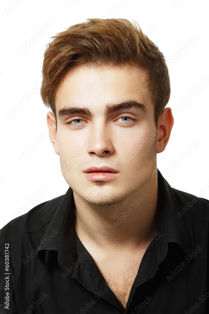 Portrait of handsome young man, sexy guy looking at camera over