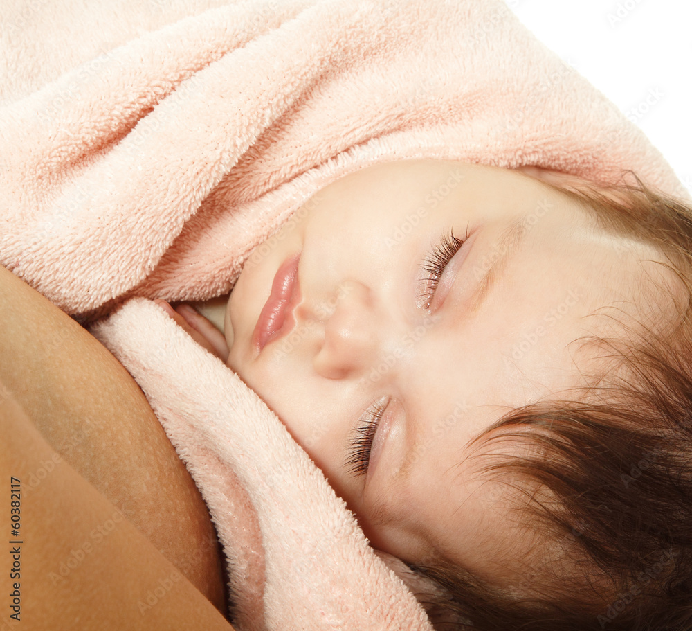 cute baby sleeping on mother's hands, beautiful kid's face close cute baby sleeping on mother's hands, beautiful kid's face close