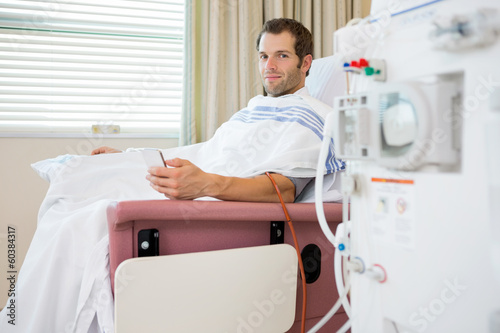 Patient Holding Mobilephone at Renal Dialysis Center
