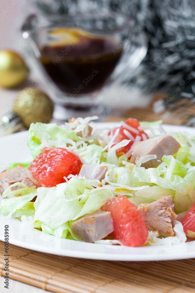 Delicious fresh salad with grapefruit, chicken, lettuce, cheese Delicious fresh salad with grapefruit, chicken, lettuce, cheese