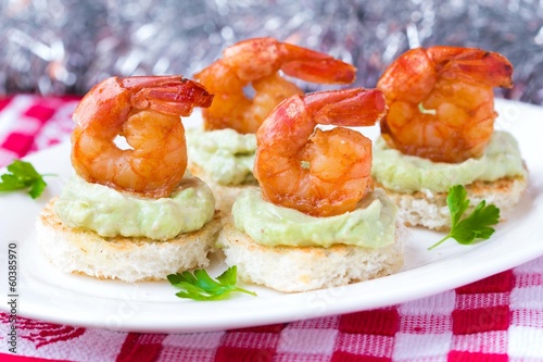 Shrimp on toast with guacamole sauce avocado, Christmas tasty