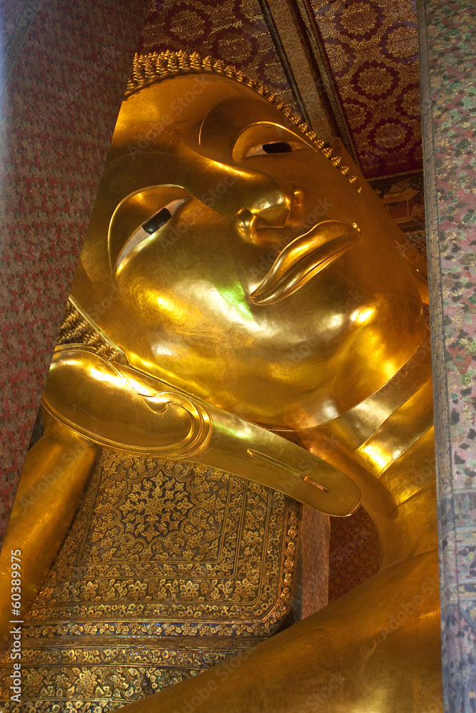 Giant image of reclining Buddha in a complex of temple Wat Pho