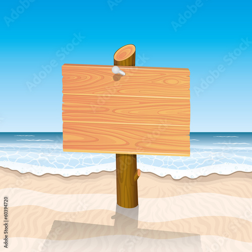Wooden sign on beach.