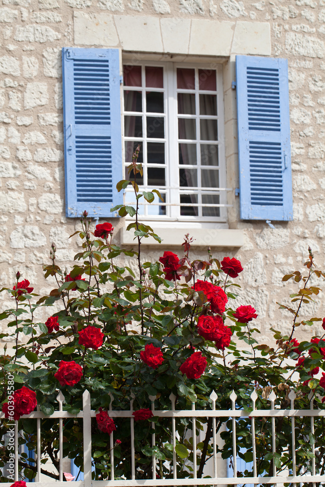 The romantic window with red roses