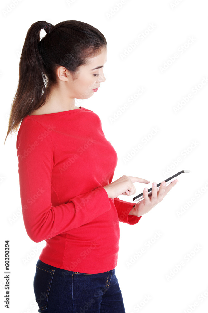 Young caucasian woman using tablet computer Young caucasian woman using tablet computer