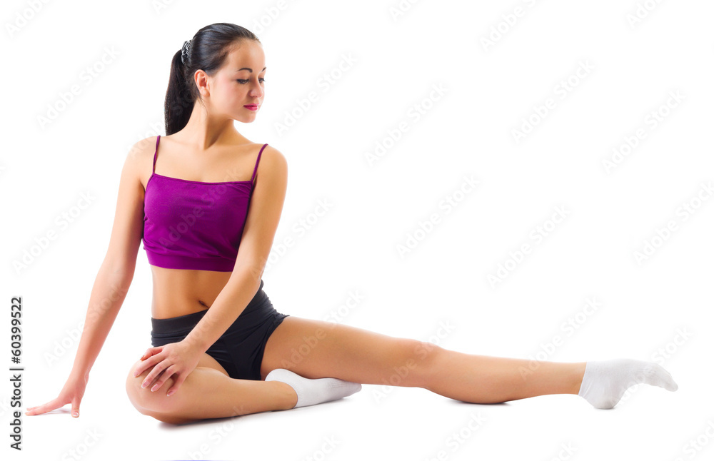 Young sporty girl doing gymnastic exercises Young sporty girl doing gymnastic exercises