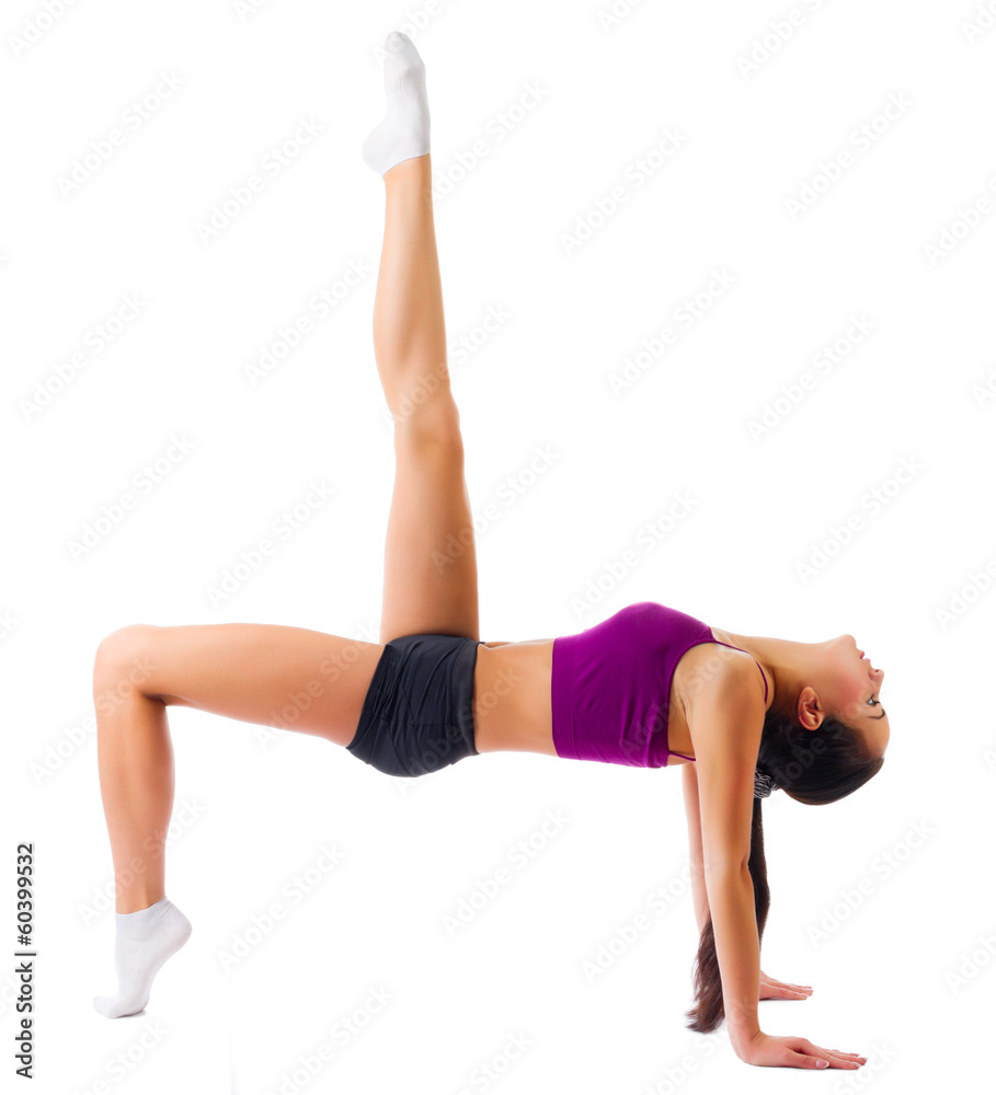 Young sporty girl doing gymnastic exercises