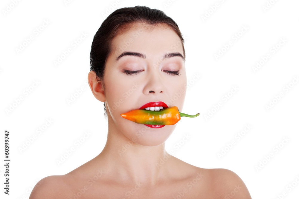 Beautiful woman with hot paprika