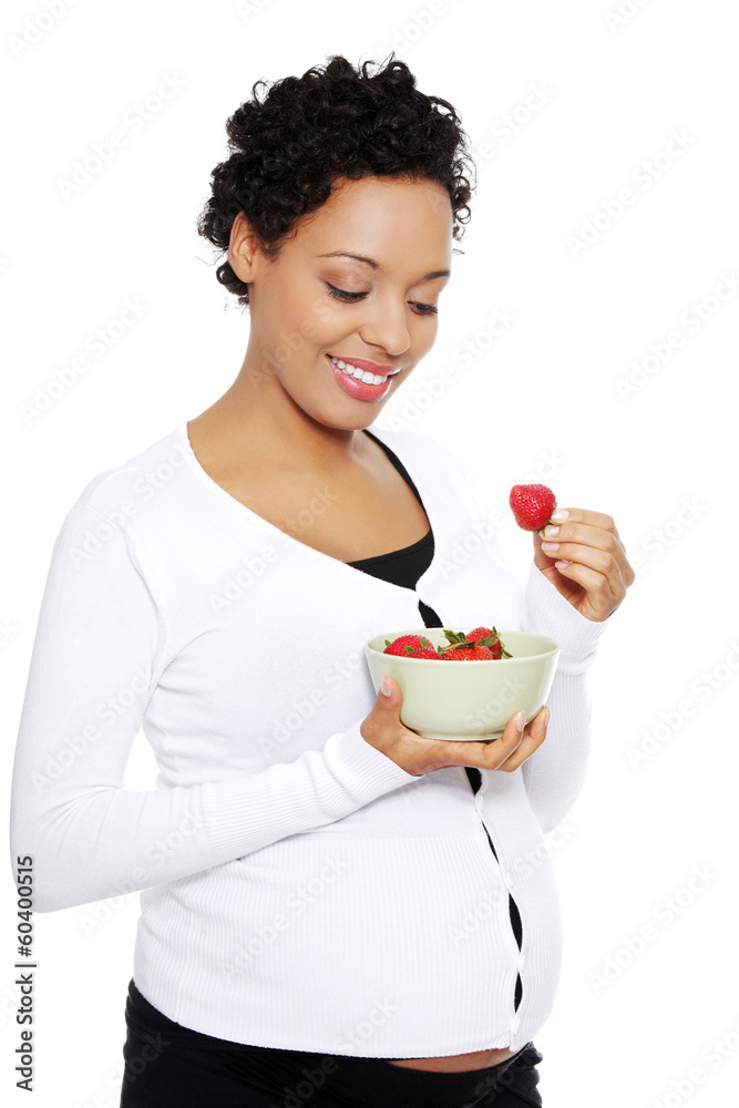 Portrait of a beautifyl young woman eating strawberries Portrait of a beautifyl young woman eating strawberries