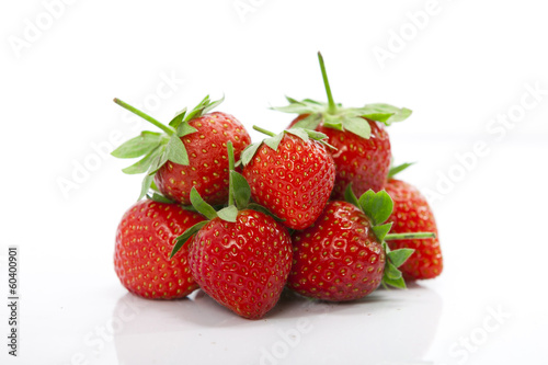 Fototapeta Naklejka Na Ścianę i Meble -  Fresh looking delicious strawberries in bulk, isolated with white ground. health food concept.