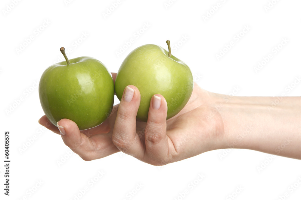 weibliche Hand mit zwei grünen Äpfel weibliche Hand mit zwei grünen Äpfel