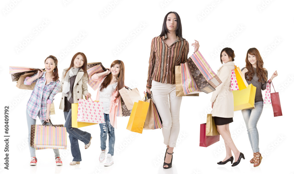 Confident Asian shopping woman with her friends Confident Asian shopping woman with her friends