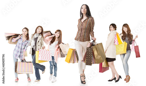Confident Asian shopping woman with her friends