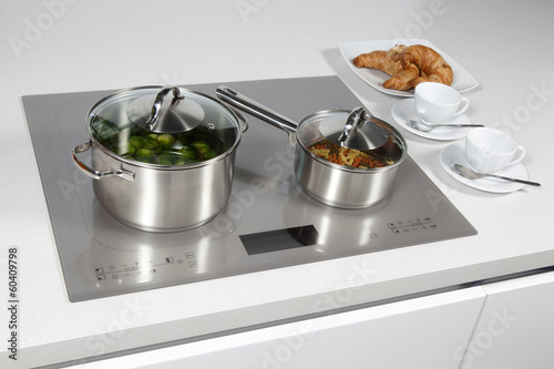 Grey glass induction hob in the kitchen 