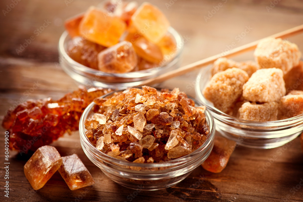 Sugar. Brown Sugar on a Wooden Background Sugar. Brown Sugar on a Wooden Background