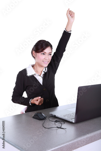 Celebrating businesswoman with laptop computer © geargodz