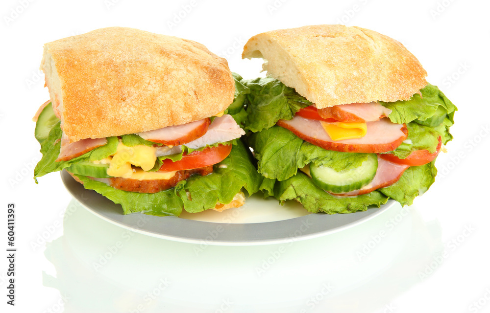 Sliced sandwich with ham and vegetables isolated on white Sliced sandwich with ham and vegetables isolated on white