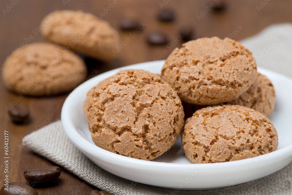 biscotti cookies in a white bowl on a wooden table biscotti cookies in a white bowl on a wooden table
