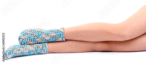 Female legs in colorful socks, isolated on white