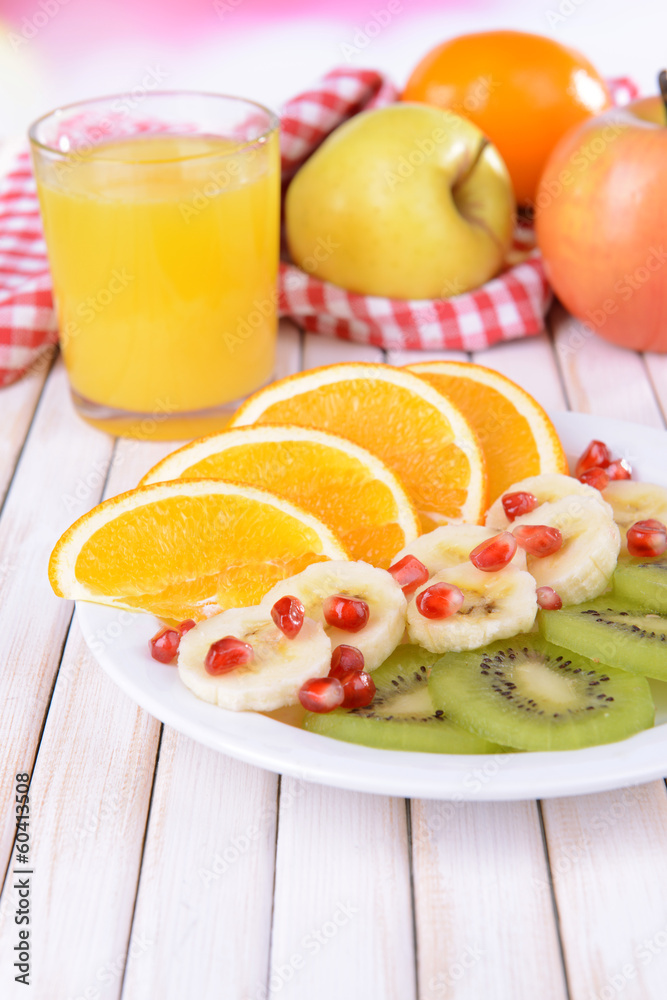 Sweet fresh fruits on plate on table close-up Sweet fresh fruits on plate on table close-up