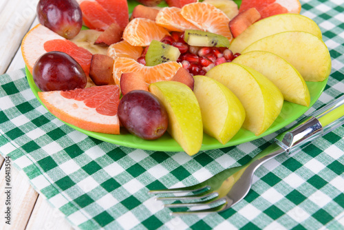 Fototapeta Naklejka Na Ścianę i Meble -  Sweet fresh fruits on plate on table close-up