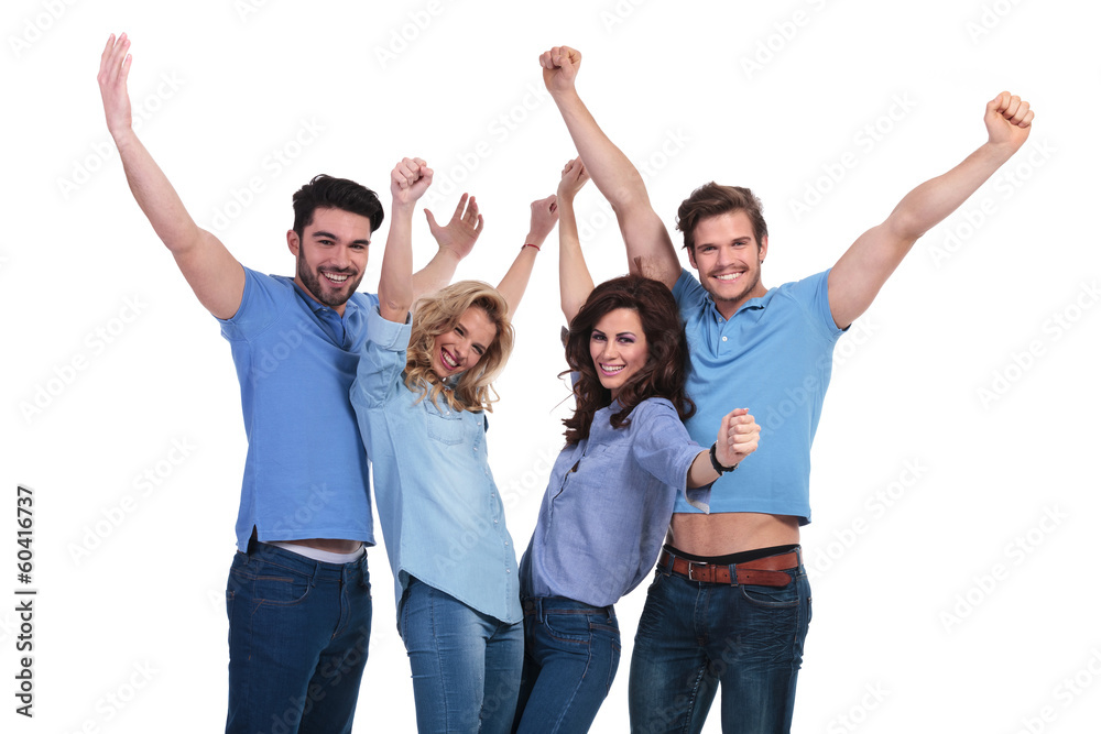 friends celebrating victory with hands in the air friends celebrating victory with hands in the air