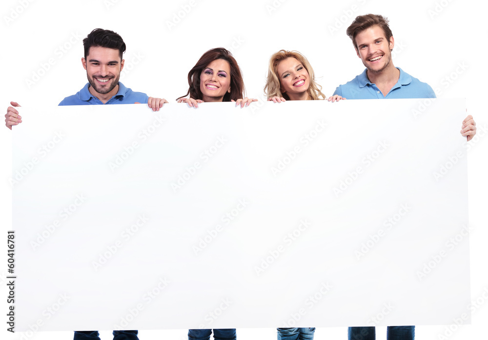 casual young people showing a big blank banner and smile casual young people showing a big blank banner and smile