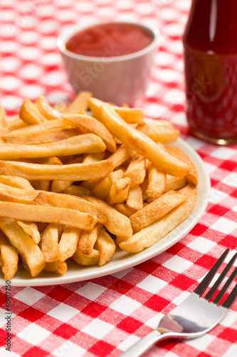 french fries on plate with ketchup