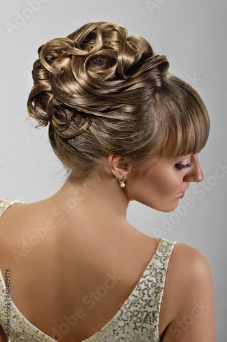 Canvas coiffure of beauty bride on grey background