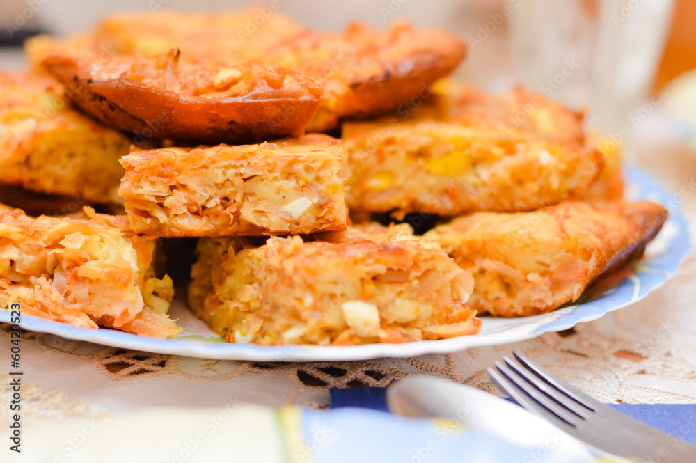Cabbage and egg pie pieces on plate Cabbage and egg pie pieces on plate