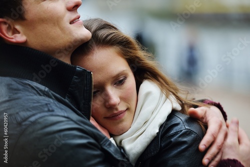 Lovely couple enjoying fall in love at park