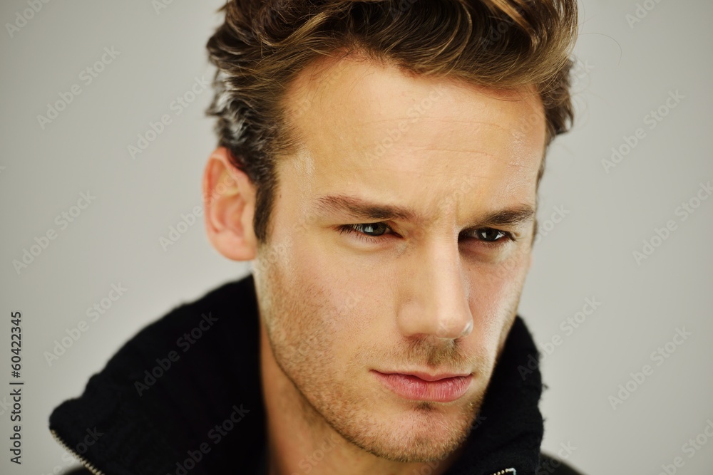 Fototapeta premium Young man studio shoot posing closeup