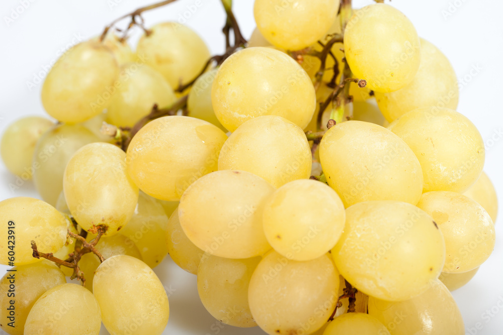 Sweet and ripe white grapes isolated on white Sweet and ripe white grapes isolated on white